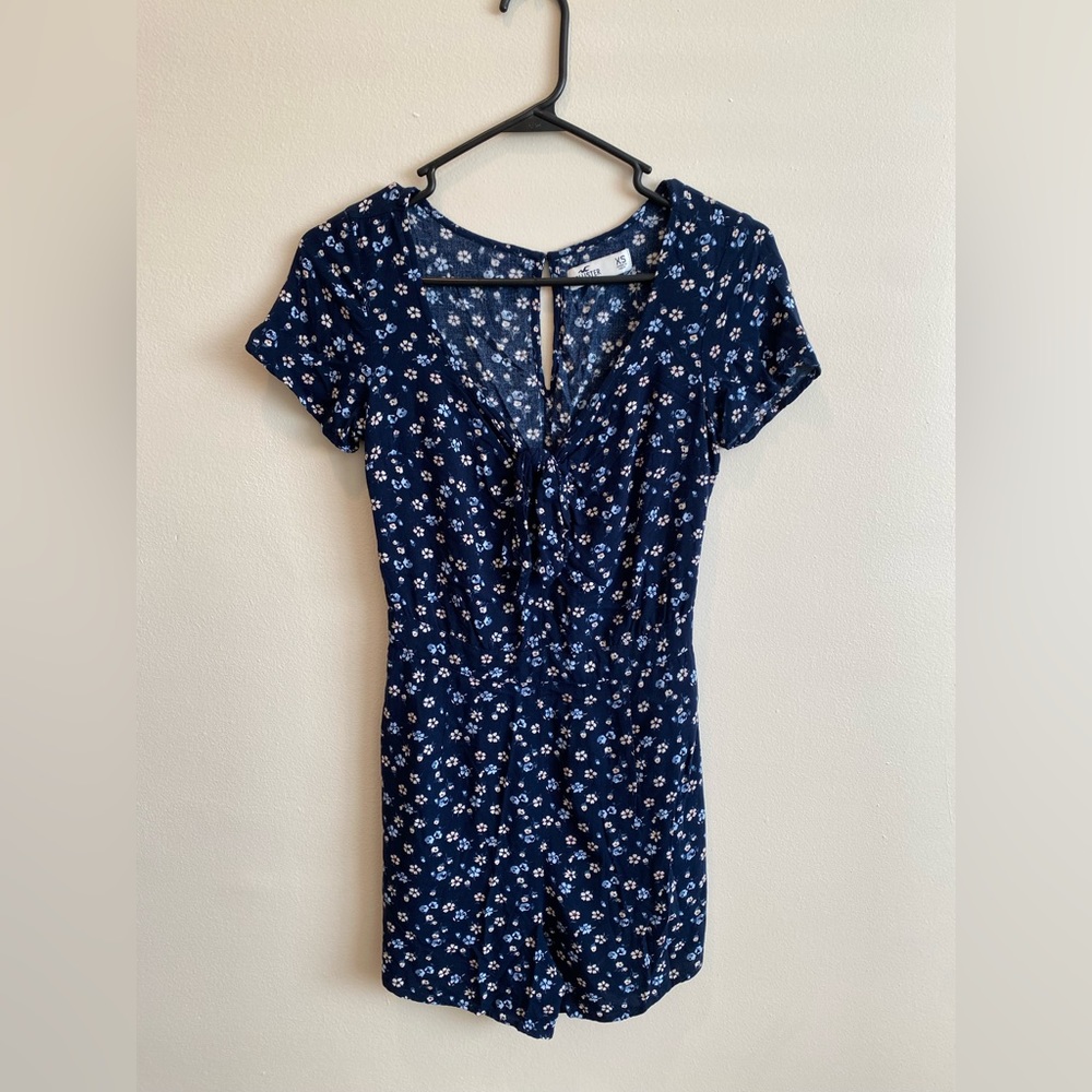 Hollister navy romper with flowers; tie in front on neckline